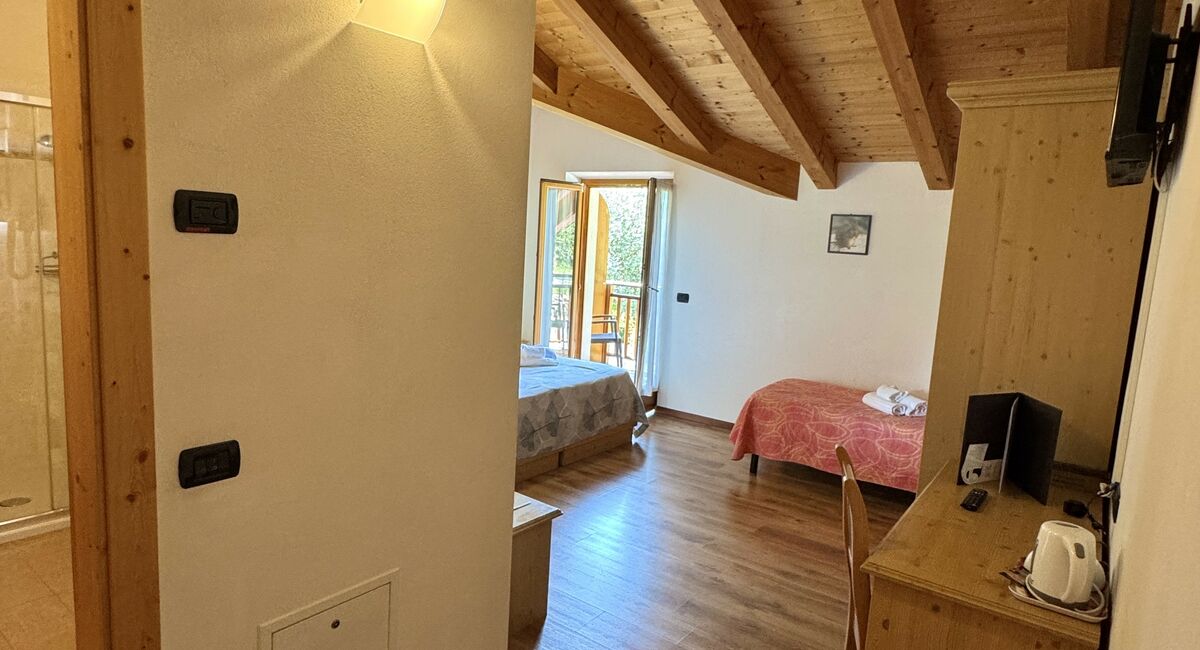 Camera famigliare | Più spazio, più comfort e ambienti pensati per condividere il soggiorno senza rinunciare alla tranquillità.
